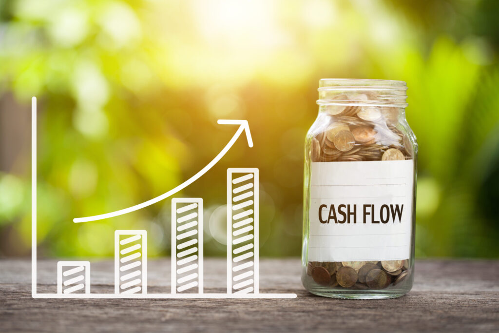 Graph showing larger amounts and a glass jar full of money with a Cash Flow label, Cash Flow Modelling